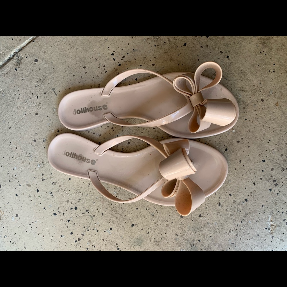 Nude bow flip flops